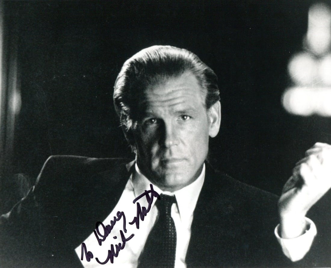 Nick Nolte Autographed 8x10 Photo: Nick Nolte Autographed 8x10 Photo Nick Nolte's distinctive face stares back from an 8x10 photo, captured in black and white. The image bears his signature in sharpie across the front, a tangible conne