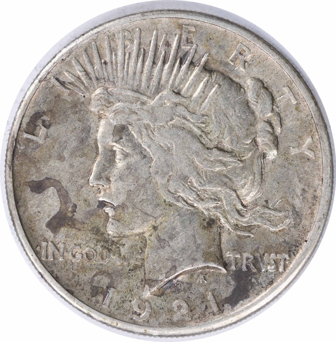 Uncertified EF Dollar Silver Peace 1921: Uncertified EF Dollar Silver Peace 1921 The 1921 Silver Peace Dollar features an elegant design with a serene image of Lady Liberty on the obverse, surrounded by a wreath of olive branches. This circu