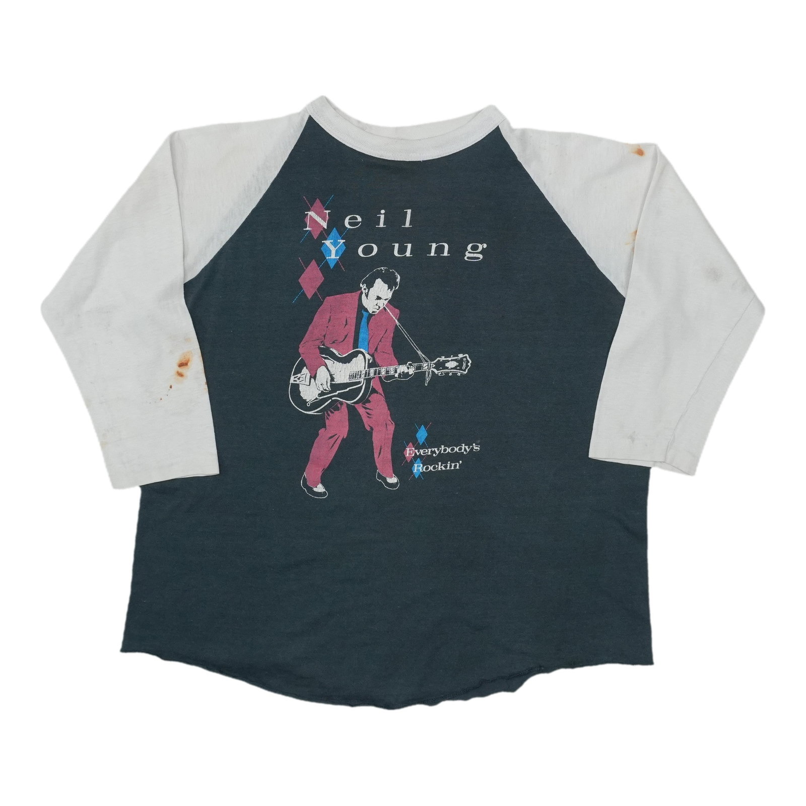 Young Rockin Everybody Neil 1983 Tour Raglan Shirt: Young Rockin Everybody Neil 1983 Tour Raglan Shirt This vintage Neil Young tour raglan shirt from 1983 is a rare find for fans of the iconic musician. Made from high-quality materials, it features a u