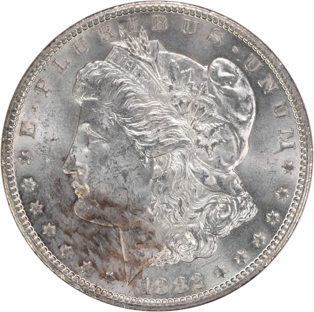 Morgan Dollar 1882 CC Choice BU Uncertified: Morgan Dollar 1882 CC Choice BU Uncertified The Morgan Dollar 1882 CC Choice BU Uncertified coin features a striking design with its iconic Lady Liberty and flowing drapery, crafted from high-quality 