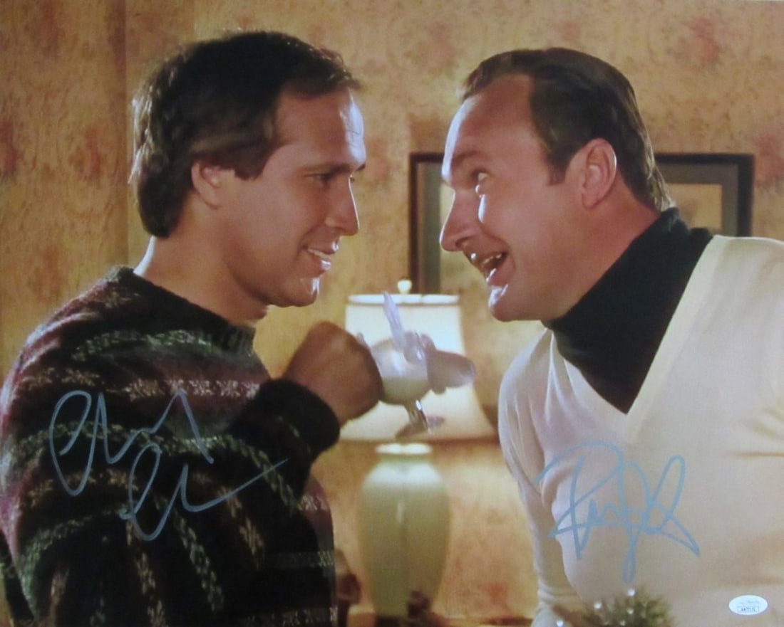 Chevy Chase/ Randy Quaid Dual-Signed 16x20 Photo "Christmas Vacation" JSA 191283: Chevy Chase/ Randy Quaid Dual-Signed 16x20 Photo "Christmas Vacation" JSA 191283 Chevy Chase and Randy Quaid have signed a unique 16x20 photo from the classic holiday film "Christmas Vacation". The ph