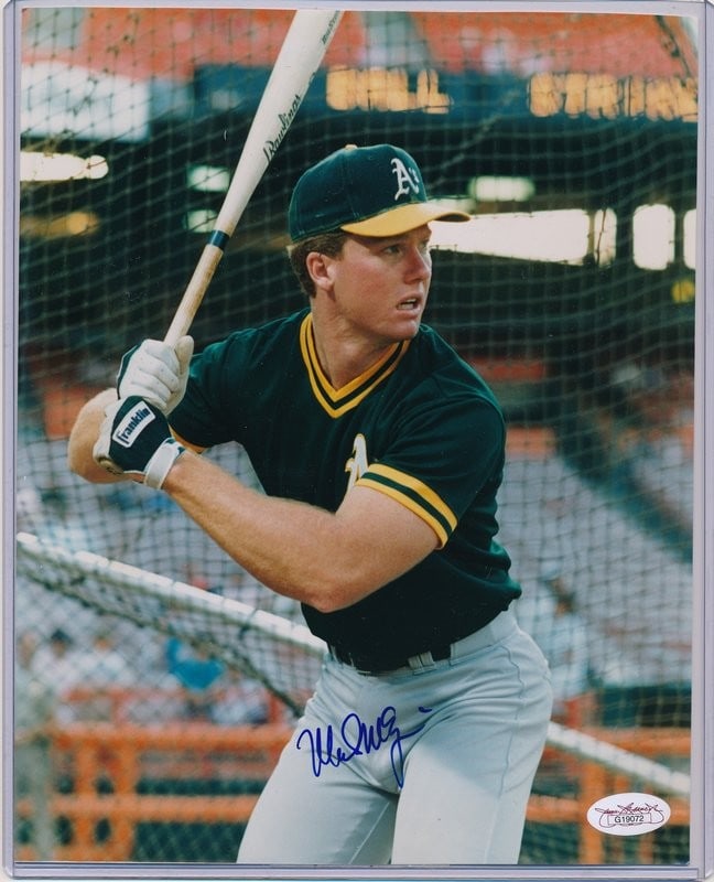 Mark McGwire Athletics Signed/ Autographed 8x10 Photo JSA 137980: Mark McGwire Athletics Signed/ Autographed 8x10 Photo JSA 137980 Mark McGwire's iconic swing captured in an 8x10 photo, signed by the legendary slugger himself. This officially authenticated image bea