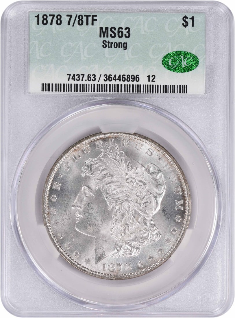 1878 Morgan Silver Dollar 7/ 8TF Strong MS63 CACG: 1878 Morgan Silver Dollar 7/ 8TF Strong MS63 CACG The 1878 Morgan Silver Dollar, graded MS63 by CACG, boasts a strong 7/8 TF grade, showcasing its exceptional condition. This uncirculated coin feature