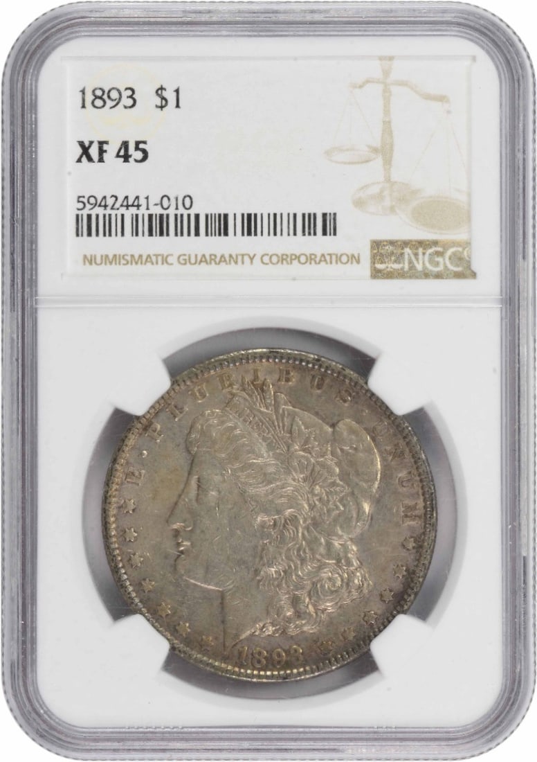 Silver dollar 1893 Morgan EF45: Silver dollar 1893 Morgan EF45 The 1893 Morgan dollar, certified by the NGC as EF45, boasts an impressive silver composition and reeded edge. With its diameter of 38.10 millimeters and weight of 26.73