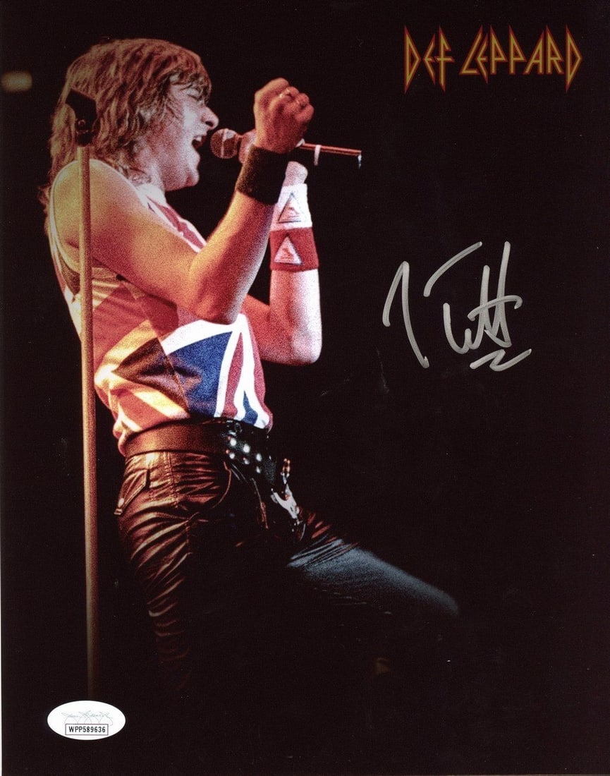 Elliott Joe Autographed Def Leppard 8x10 Photo 170281: Elliott Joe Autographed Def Leppard 8x10 Photo 170281 Elliott Joe's name appears on this rare and unique Def Leppard 8x10 photo, making it a must-have for serious collectors. The photo bears the signa