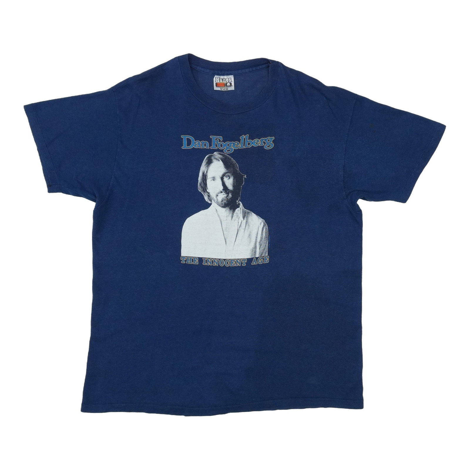 Dan Fogelberg Innocent Age Shirt: Dan Fogelberg Innocent Age Shirt This iconic shirt features a striking design inspired by Dan Fogelberg's beloved album, Innocent Age. With its unique blend of folk and rock elements, this vintage tee