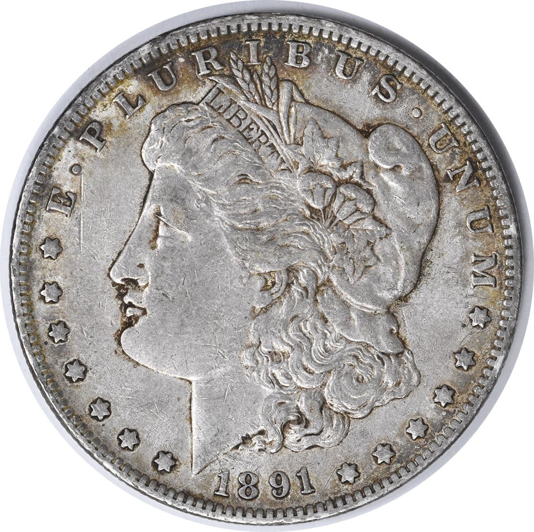 Uncertified EF 1891 Morgan Silver Dollar: Uncertified EF 1891 Morgan Silver Dollar The 1891 Morgan Silver Dollar features a reeded edge and bears the mint mark 'O' for New Orleans, showcasing its distinct origin. With a diameter of 38.10 mill
