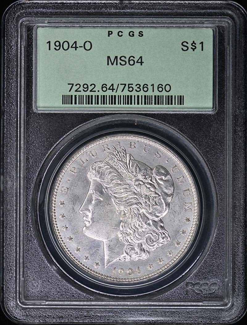 MS64 OGH PCGS 1904-O $1 Dollar: MS64 OGH PCGS 1904-O $1 Dollar MS64 OGH PCGS 1904-O $1 Dollar - A rare and highly detailed Morgan dollar from the 1904 New Orleans mint, certified by the prestigious PCGS as MS64. This uncirculated co