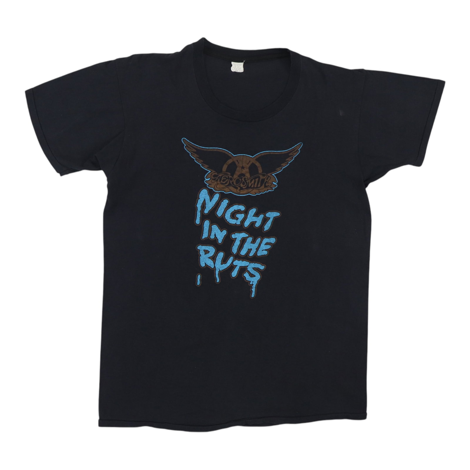 Aerosmith Night In The Shirt Ruts 1979: Aerosmith Night In The Shirt Ruts 1979 Aerosmith's iconic Night In The Ruts shirt from 1979, featuring the band's distinctive logo and design. This vintage tee has been carefully preserved to retain i