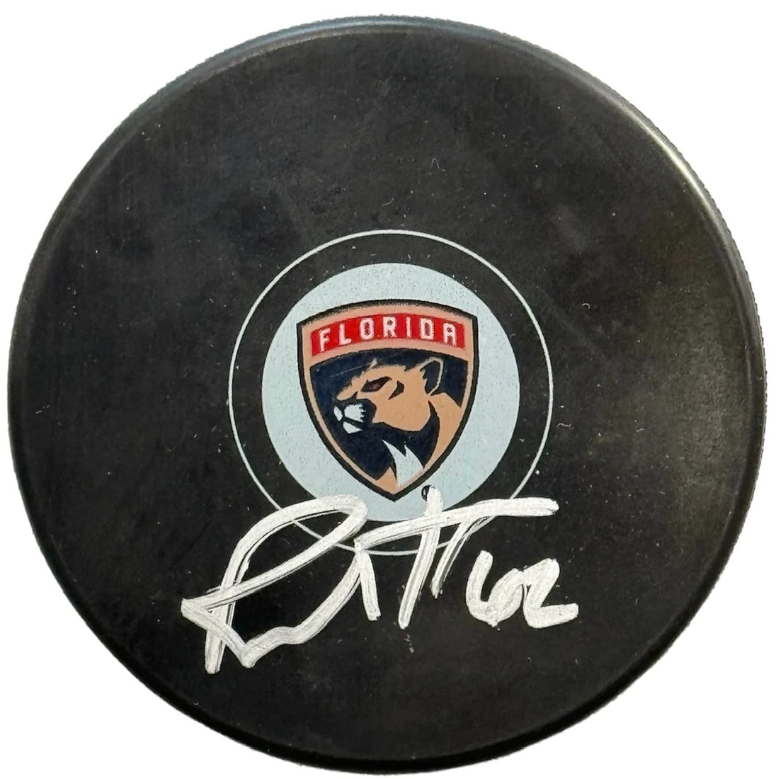 Brandon Montour Autographed Panthers Logo Puck (JSA) (1 of 2)