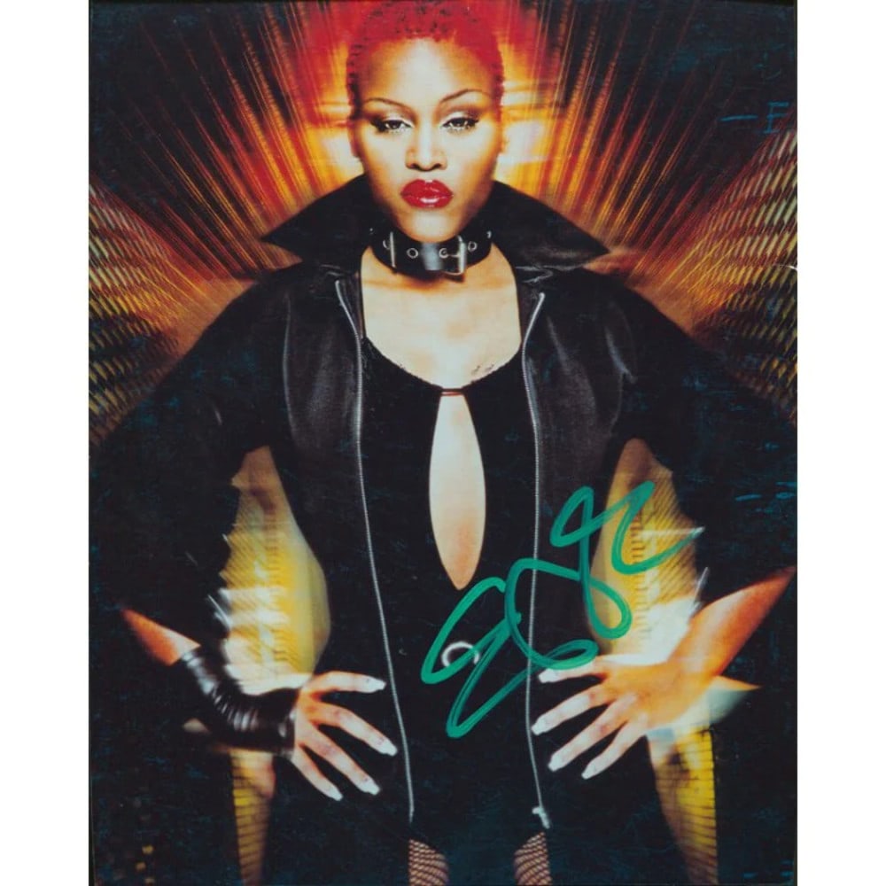 Eve Autographed 8x10 Photo: Eve Autographed 8x10 Photo Eve's 8x10 photo bears her signature in green sharpie, making it a unique piece for fans and collectors. The image itself is an 8x10 photograph, providing a substantial size