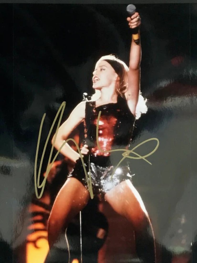 Kylie Minogue Autographed 8x10 Celebrity Photo: Kylie Minogue Autographed 8x10 Celebrity Photo Kylie Minogue's iconic image shines in this 8x10 celebrity photo, signed in gold sharpie across the front. A rare opportunity to own a piece of pop cultu