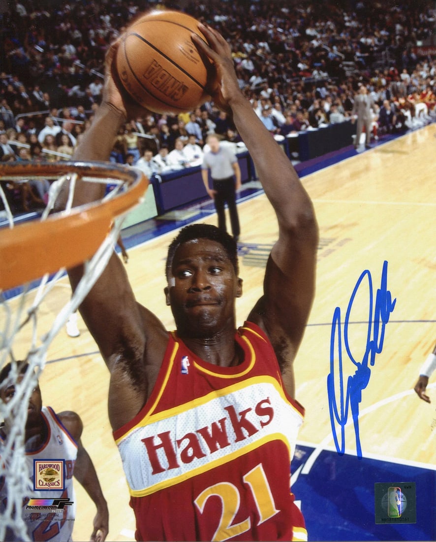 Dominique Wilkins Autographed 8x10 Photo: Dominique Wilkins Autographed 8x10 Photo Item Specifics: Signed in blue sharpie across the front of the photo Dominiuqe is slam dunking, while playing with the Atlanta Hawks Item is authenticated by R