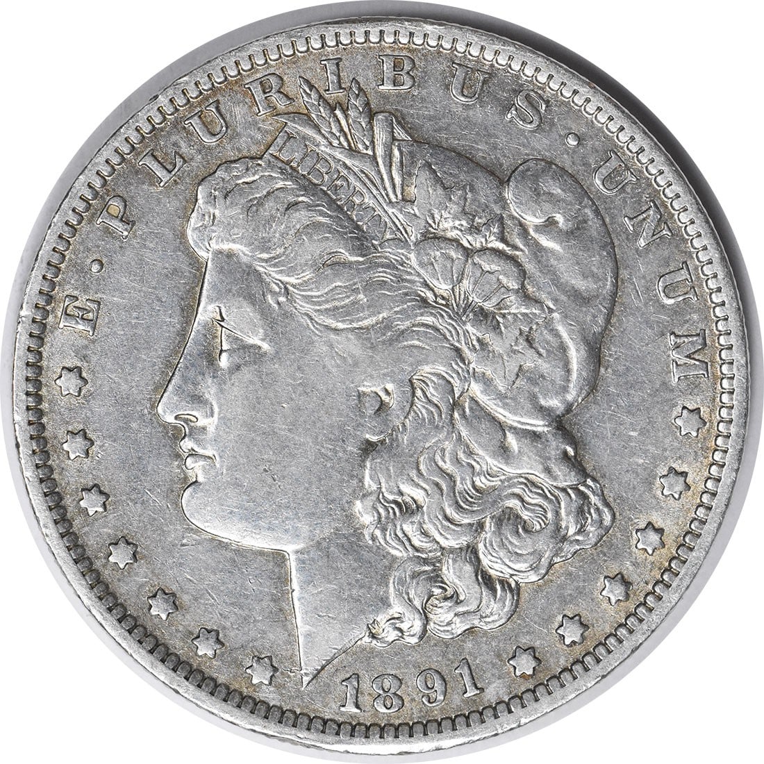 Uncertified EF 1891 Morgan Silver Dollar: Uncertified EF 1891 Morgan Silver Dollar The 1891 Morgan Silver Dollar features a reeded edge and bears the mint mark 'O' for New Orleans, showcasing its distinct origin. With a diameter of 38.10 mill