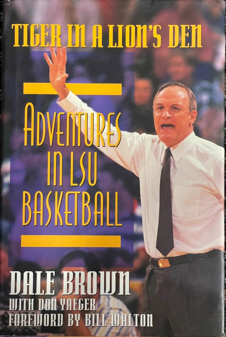 Dale Brown autographed Tiger in a Lion's Den Book: Dale Brown autographed Tiger in a Lion's Den Book Tiger in a Lion's Den, a novel by Dale Brown, bears a blue pen inscription on the inside cover from the author to Rich, reading "Dear Rich Never Give 