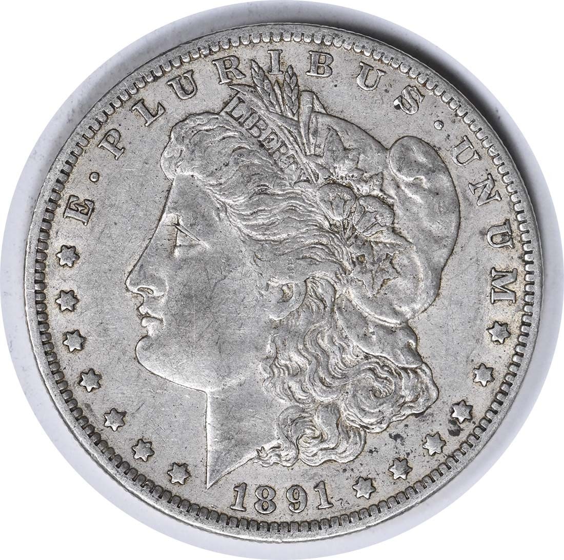 Uncertified EF 1891 Morgan Silver Dollar: Uncertified EF 1891 Morgan Silver Dollar The 1891 Morgan Silver Dollar features a reeded edge and bears the mint mark 'O' for New Orleans, showcasing its distinct origin. With a diameter of 38.10 mill