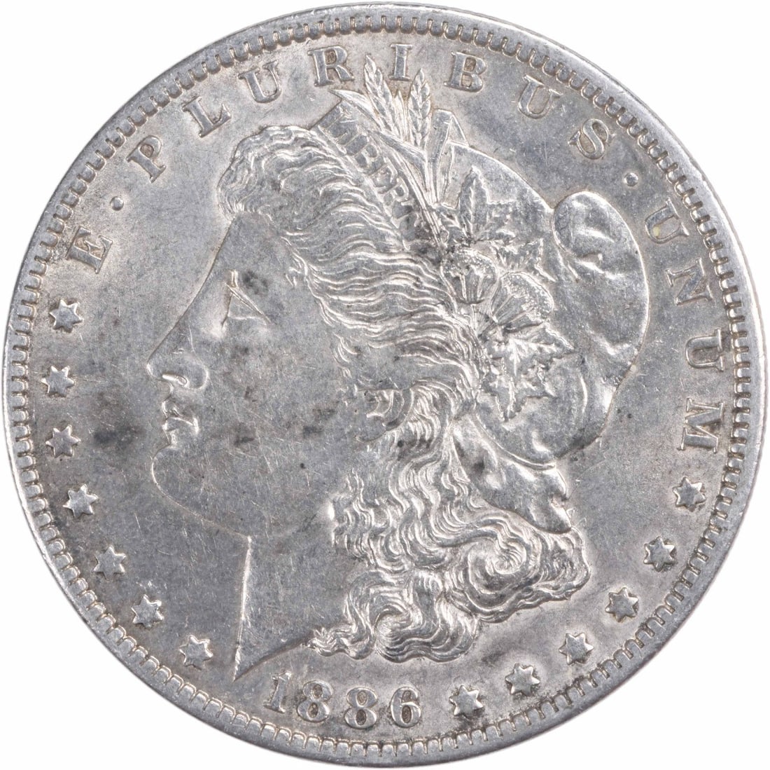 Morgan Silver Dollar AU Uncertified 1886: Morgan Silver Dollar AU Uncertified 1886 The Morgan Silver Dollar, minted in 1886 at the New Orleans Mint, boasts an impressive diameter of 38.10 millimeters and a weight of 26.73 grams. This circulat