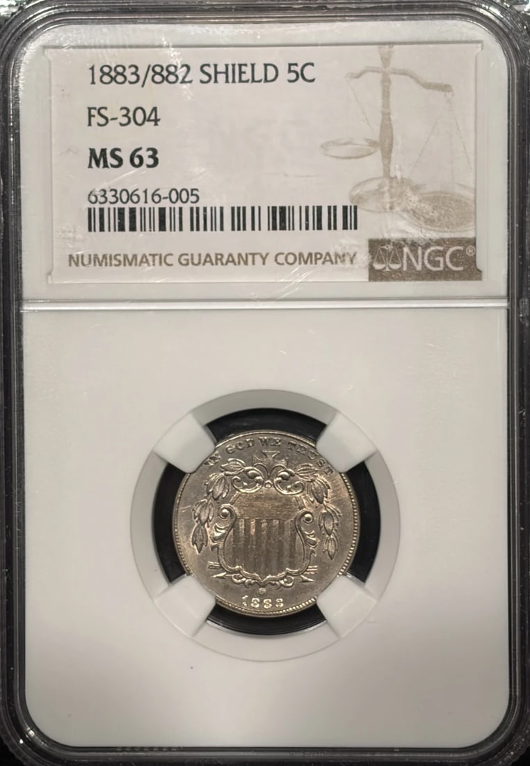 1883/ 882 SHIELD NICKEL FS-304 NGC MS63: 1883/ 882 SHIELD NICKEL FS-304 NGC MS63 1883 Shield Nickel MS63, certified by the NGC. This uncirculated coin features the iconic shield design and has been graded MS63 for its high level of preservat