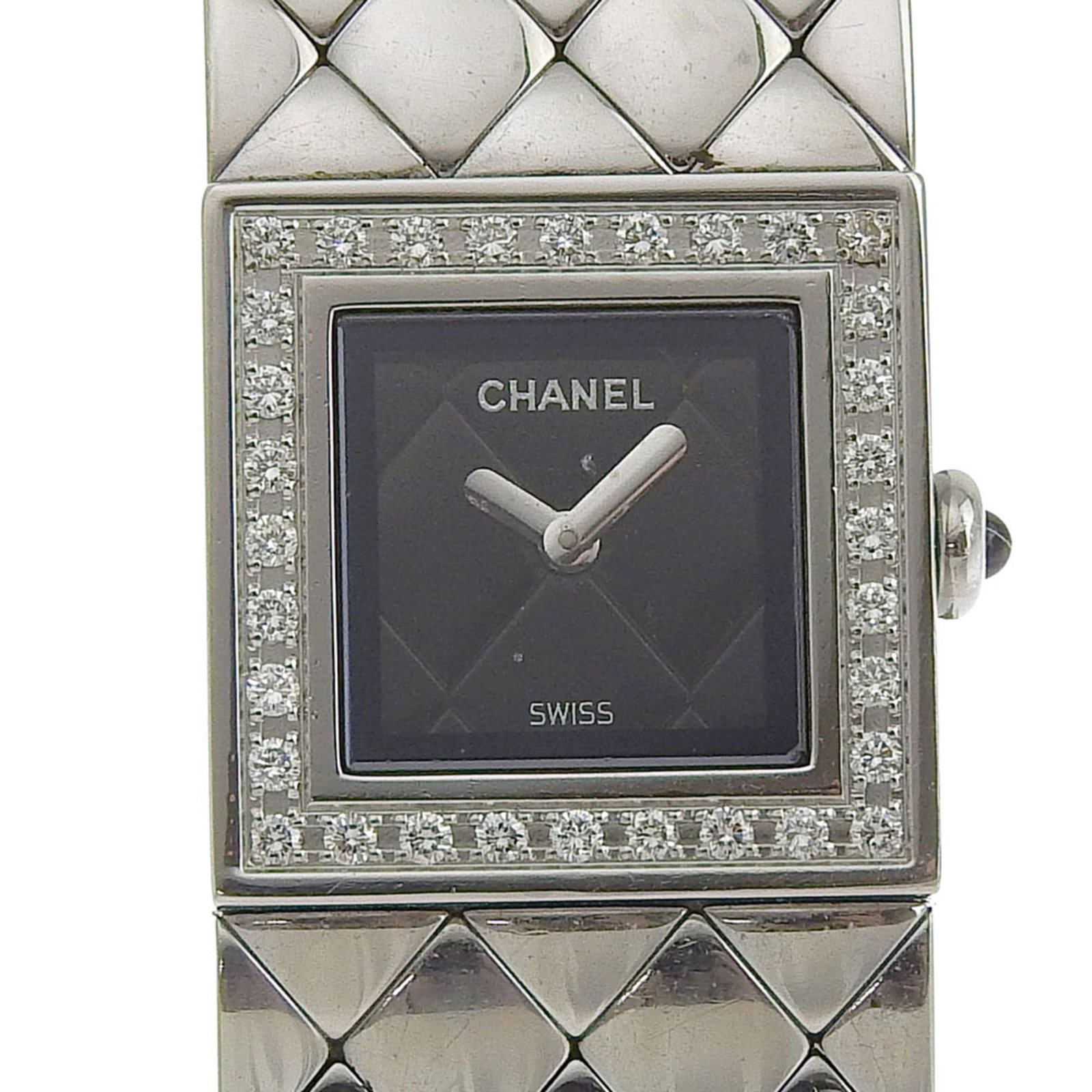Chanel Wristwatch: Chanel Wristwatch Stainless steel case and band provide a sleek, modern look for this black analog Chanel wristwatch. Measuring 19mm in diameter, the watch features an elegant design that suits a