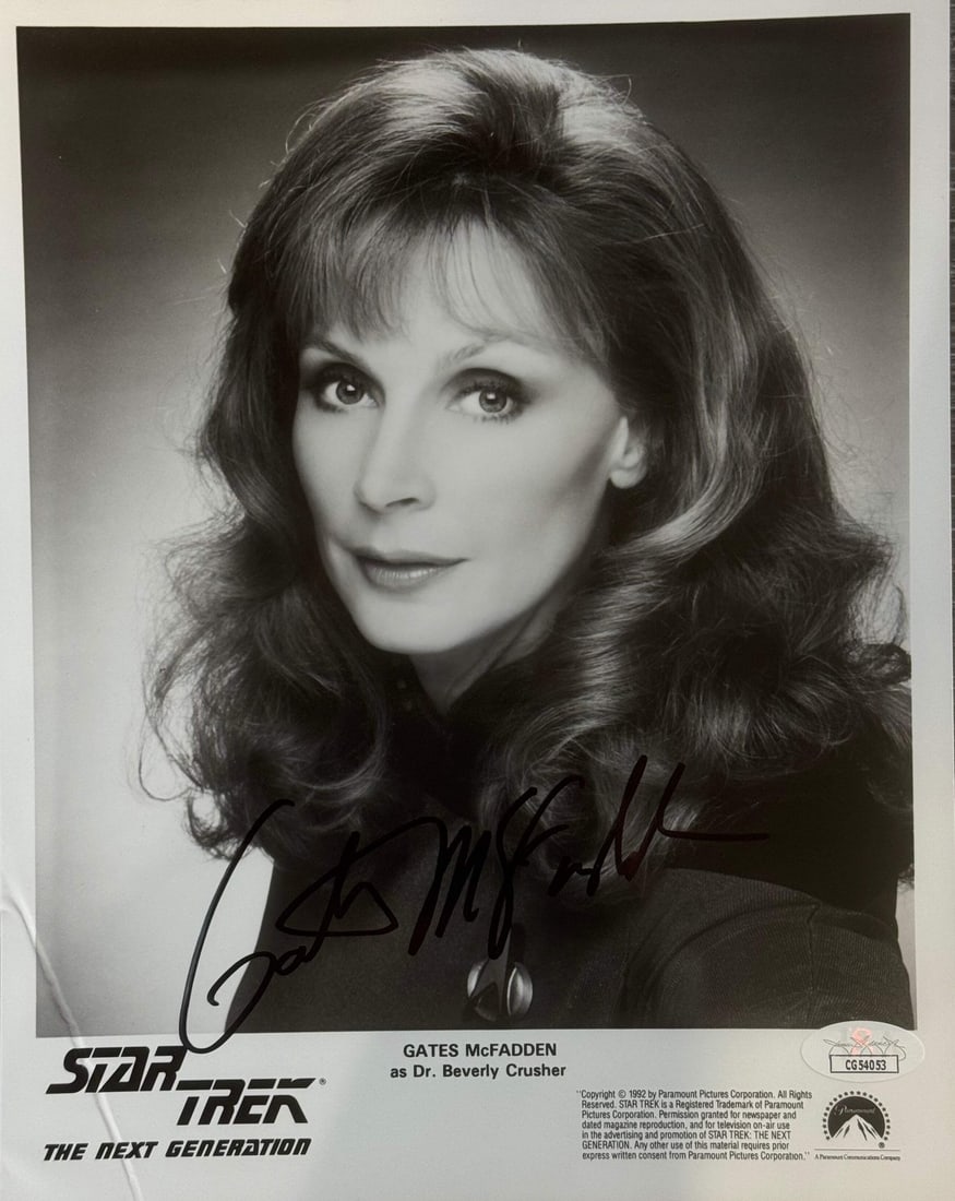 Autographed Photo by McFadden for JSA Star Trek Gates: Autographed Photo by McFadden for JSA Star Trek Gates Authentic Autographed Photo by Gates McFadden for JSA Star Trek. This photo, signed in black sharpie across the front, bears a signature from Gate