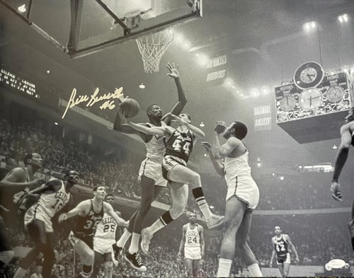 Russell Autographed 16x20 Photo vs Lakers By JSA: Russell Autographed 16x20 Photo vs Lakers By JSA Signed across the front in silver sharpie, Bill Russell's signature adds a touch of NBA legend to this 16x20 photo. The James Spence Authentication (JS