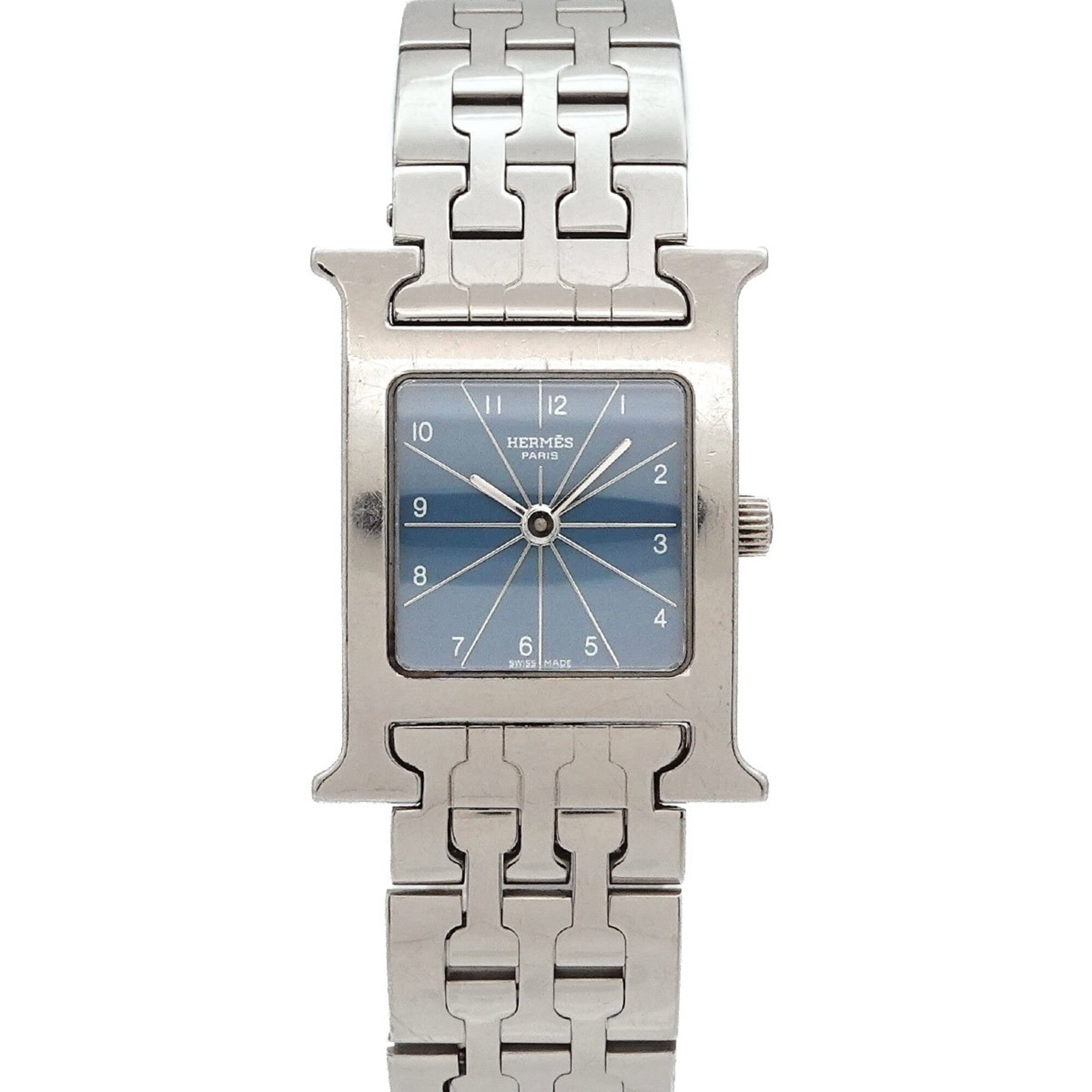 Hermes Wristwatch: Hermes Wristwatch Stainless steel case and band, the Hermes wristwatch boasts a sleek design with a blue dial. Powered by a quartz movement, this timepiece is precise and reliable. With its compact si