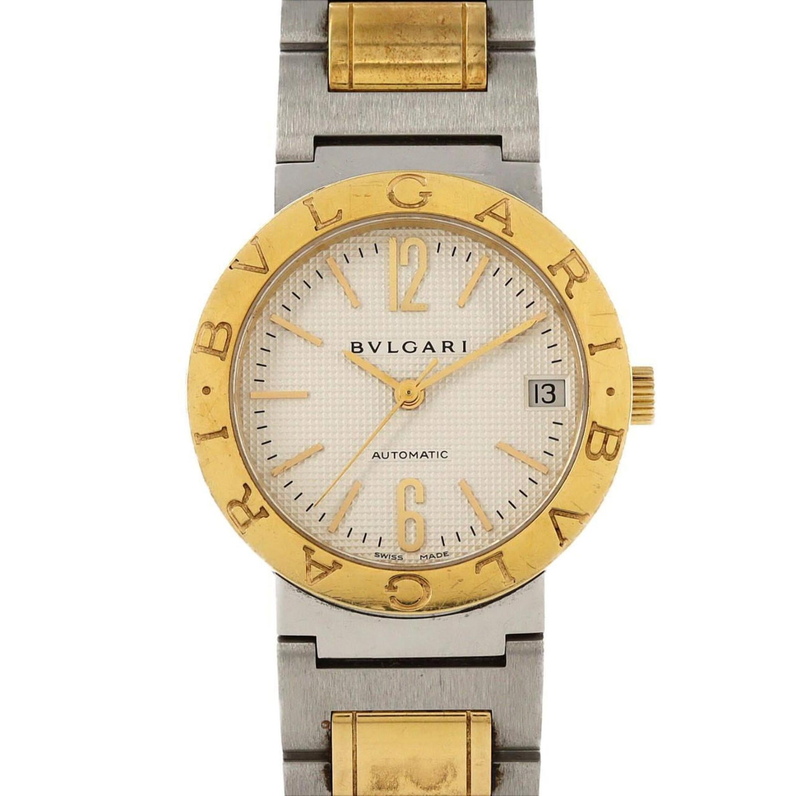 Bvlgari Wristwatch: Bvlgari Wristwatch Stainless steel and yellow gold combine in sleek, modern lines, defining the Bvlgari wristwatch. With its self-winding automatic movement and silver dial, this timepiece boasts a so