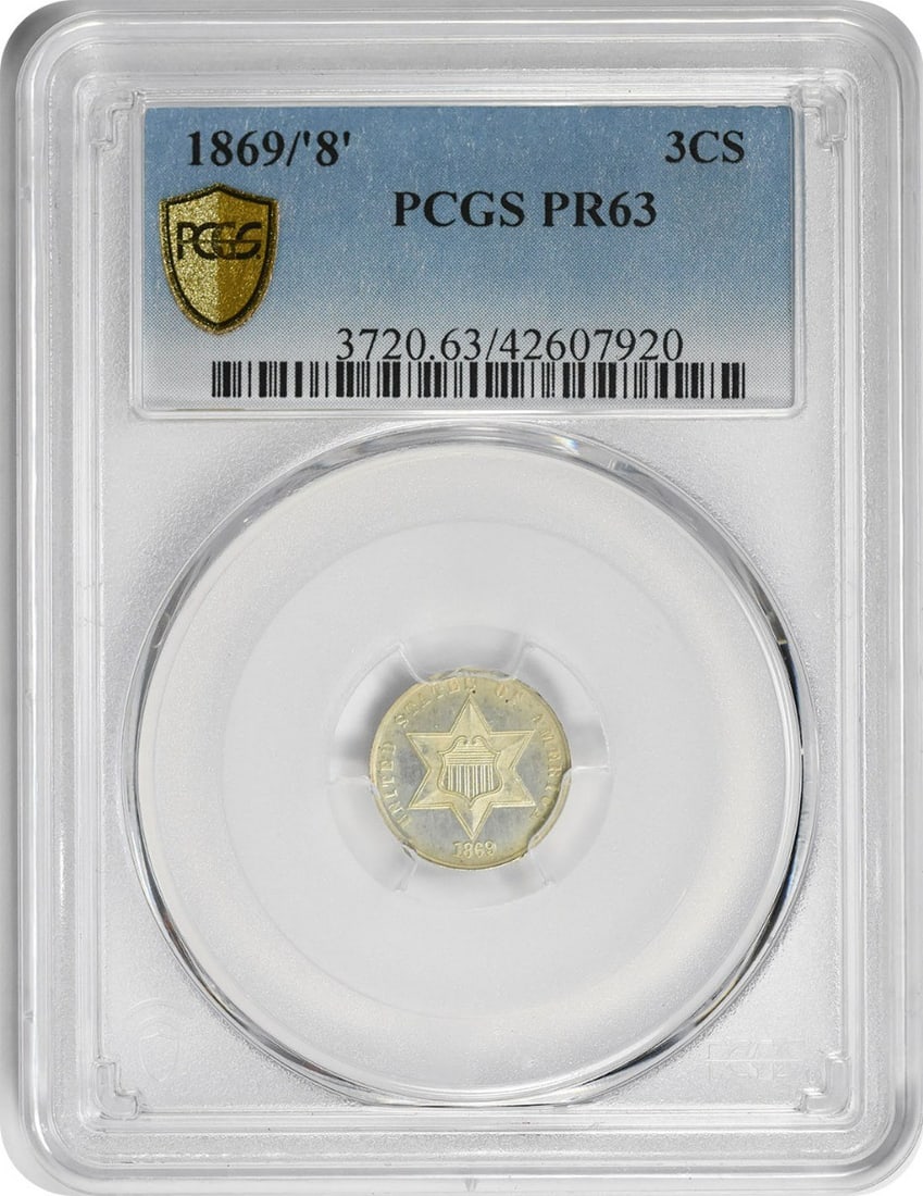 1869/ 8 Three Cent Silver PR63 PCGS: 1869/ 8 Three Cent Silver PR63 PCGS The 1869/8 Three Cent Silver coin, graded PR63 by PCGS, boasts a striking proof finish and a rich history as one of the earliest coins minted in Philadelphia. With 