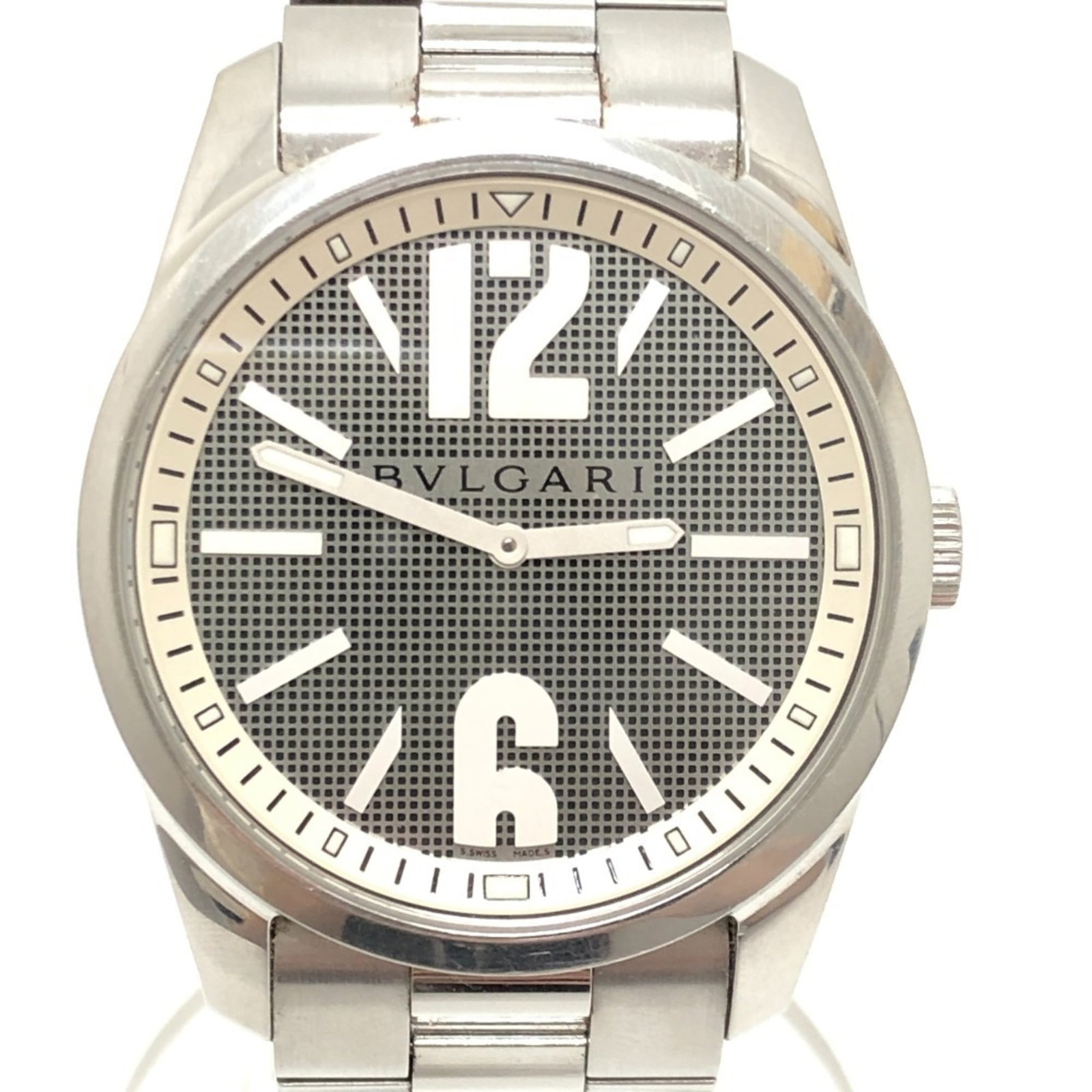 Bvlgari Wristwatch: Bvlgari Wristwatch Bvlgari's ST42S wristwatch boasts a sleek silver stainless steel case and band, complemented by a black analog dial. This quartz-powered timepiece features a sturdy 42mm diameter ca