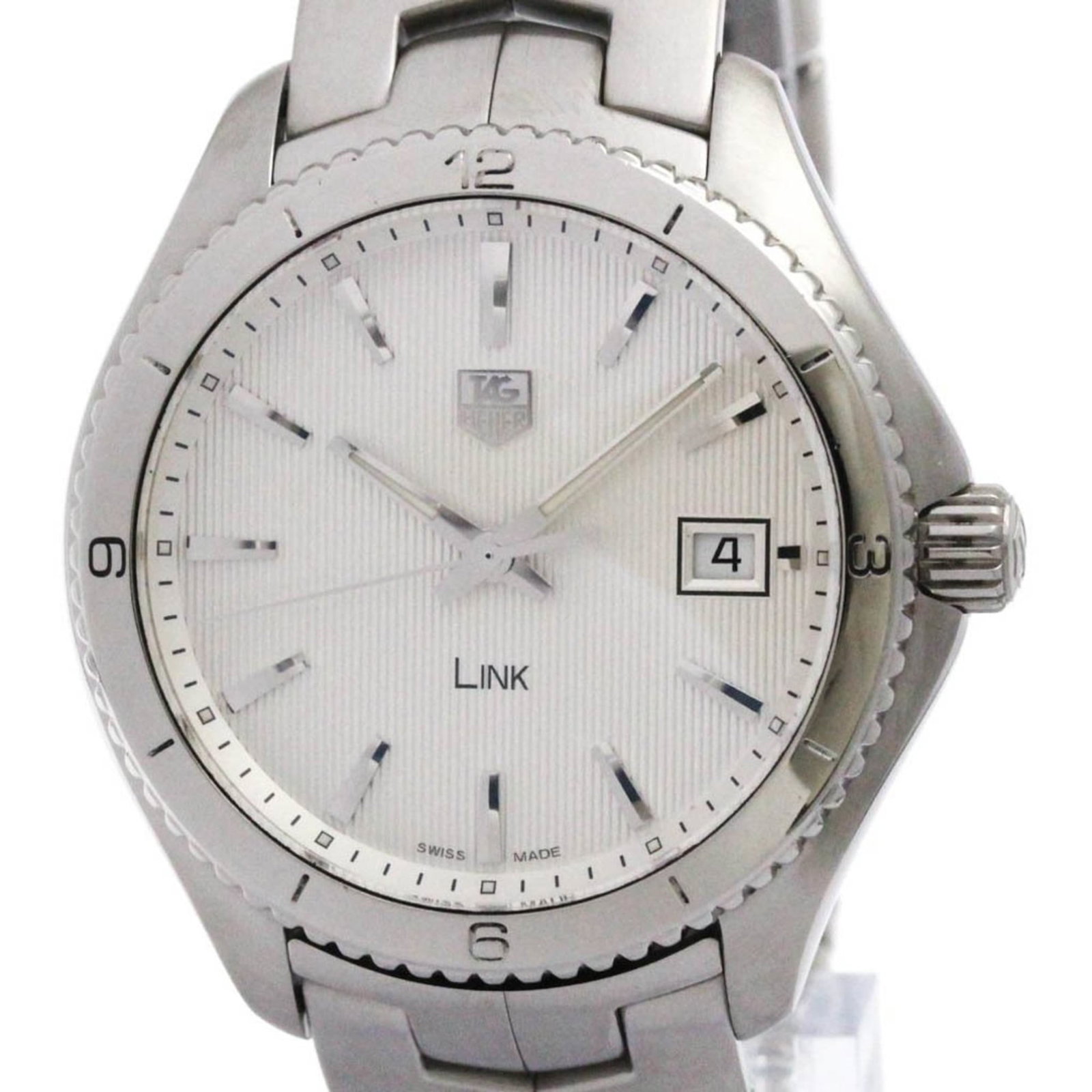 Wristwatch by Tag Heuer: Wristwatch by Tag Heuer Stainless steel case and band provide a sleek, sporty look for the Tag Heuer Link Wristwatch. With its silver dial and quartz movement, this timepiece keeps accurate time