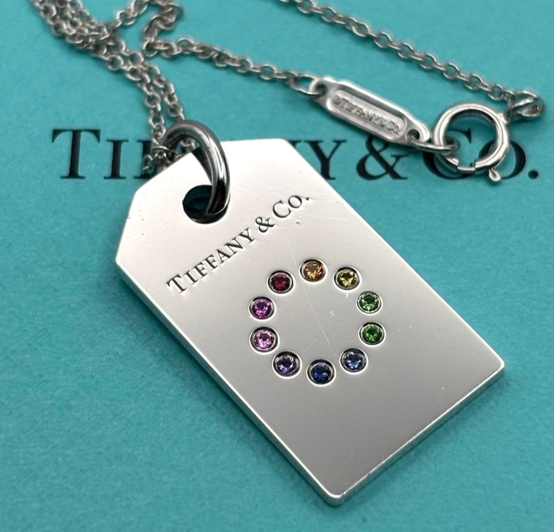 Tiffany & Co 10 Color Multi Stone Wheel Tag 18k White Gold Pendant Necklace: Tiffany & Co 10 Color Multi Stone Wheel Tag 18k White Gold Pendant Necklace Item Specifics: Pendant Shape: Tag Main Stone Creation: Natural Occasion: Anniversary Birthday Christening Christmas Confirm