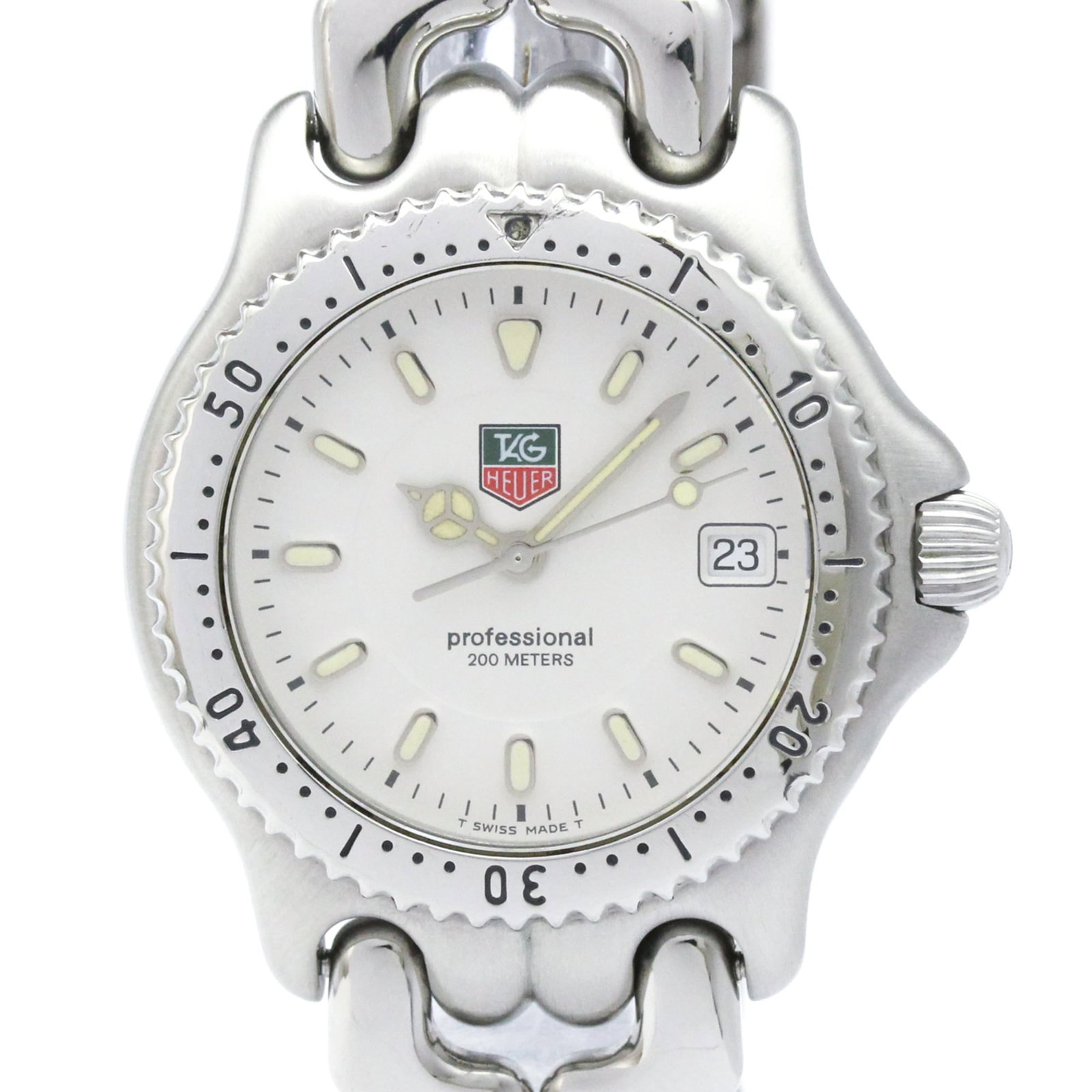 Wristwatch by Tag Heuer: Wristwatch by Tag Heuer Stainless steel case and band, the Tag Heuer WG1212 wristwatch boasts a sleek white dial. This quartz-powered timepiece features a date function and weighs in at 90g. With its 