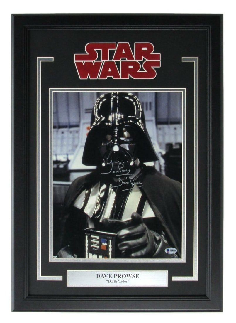 Prowse David "Vader" Darth Signed Photo Framed Star Wars 162188: Prowse David "Vader" Darth Signed Photo Framed Star Wars 162188 A framed photo of David Prowse, the actor who portrayed Darth Vader in the original Star Wars trilogy, bears his signature. The item is 