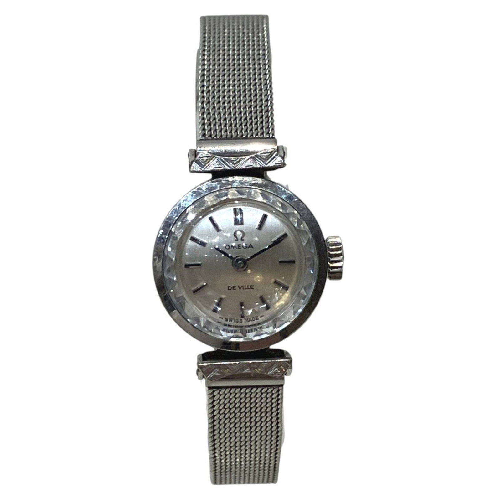 Omega Wristwatch: Omega Wristwatch Omega's manual winding mechanical movement provides precision timekeeping, while the stainless steel case and band offer durability and style. This silver-dialled Omega wristwatch is 