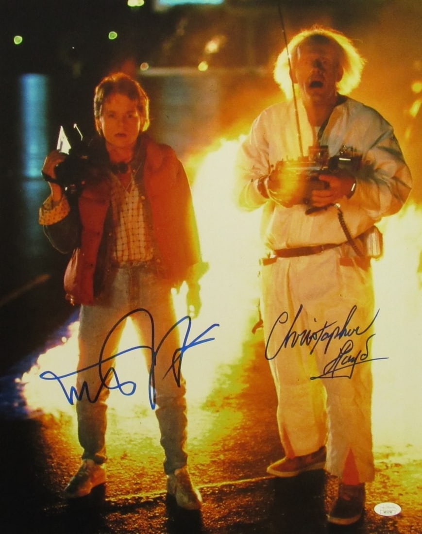 Michael J Fox/ Christopher Lloyd Sign/ Auto 16x20 Photo Back to the Future JSA 686: Michael J Fox/ Christopher Lloyd Sign/ Auto 16x20 Photo Back to the Future JSA 686 Signed by Michael J Fox and Christopher Lloyd, this 16x20 photo back to the future features an auto from the iconic D