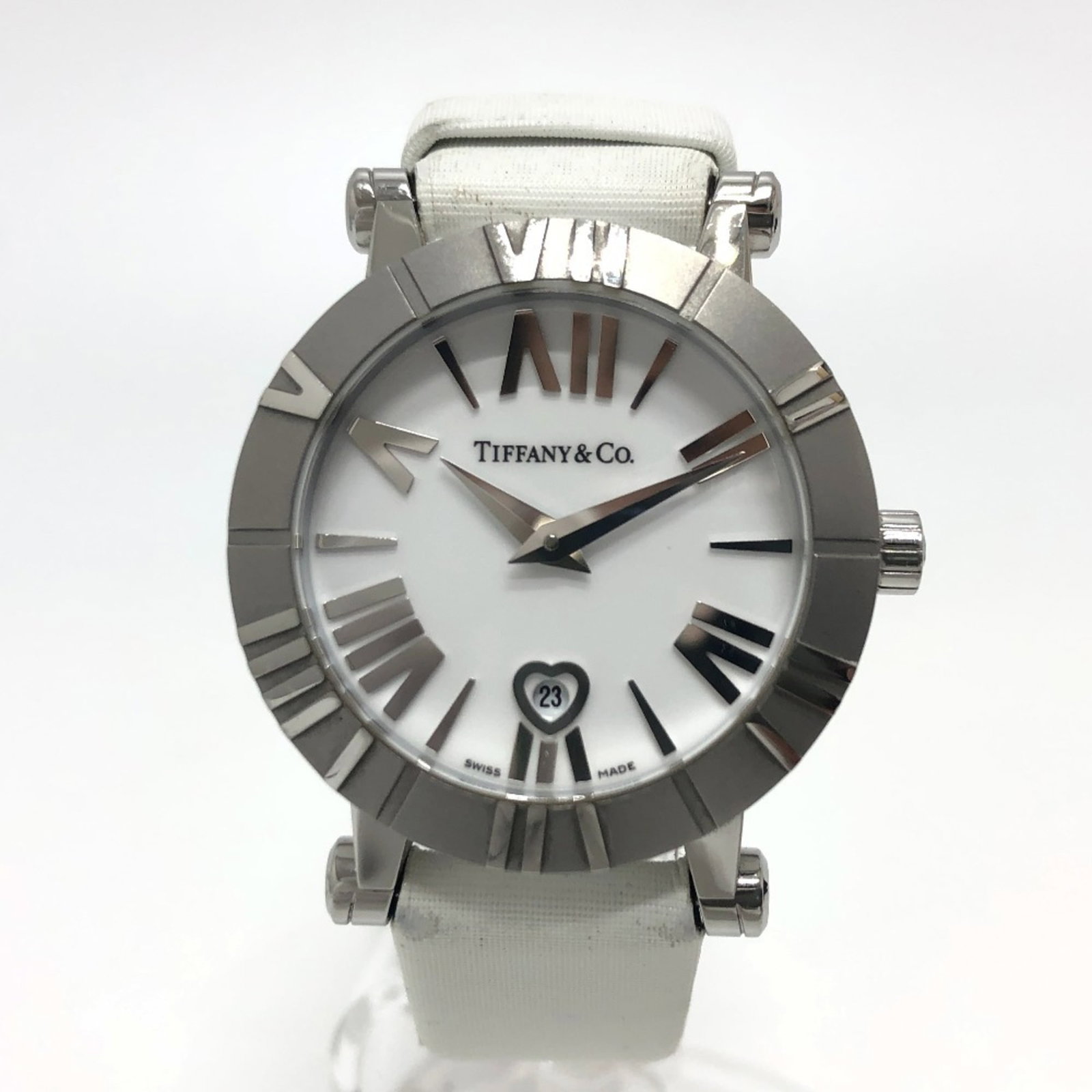 Tiffany Wristwatch: Tiffany Wristwatch Ceramic and stainless steel construction provides a sleek, modern look. The leather band adds a touch of elegance to the white analog dial, while the quartz movement ensures