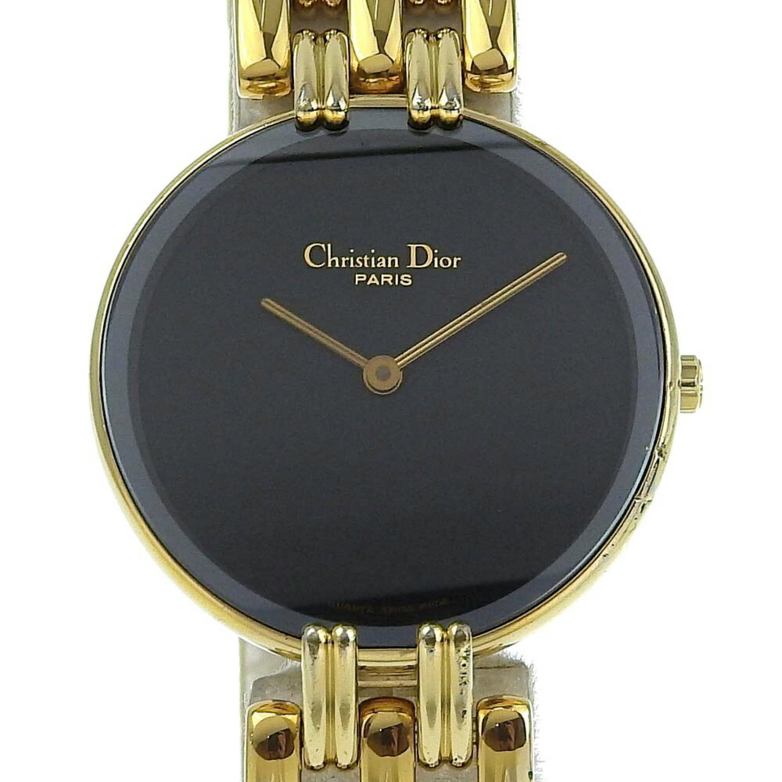 Wristwatch by Christian Dior: Wristwatch by Christian Dior Gold plated case and band add a touch of luxury to this Christian Dior wristwatch, featuring a sleek black dial. The quartz movement keeps time with precision, while the 2