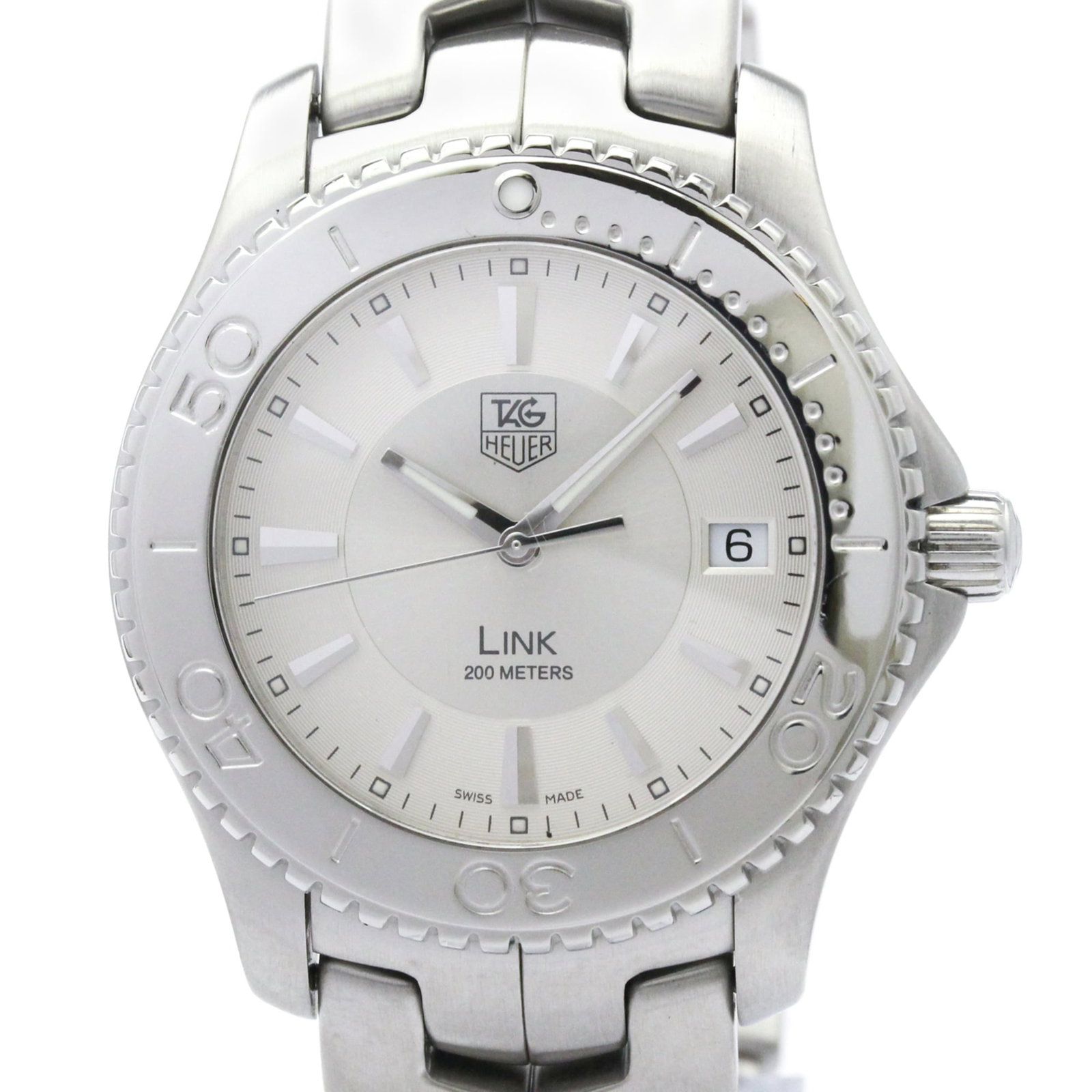 Wristwatch by Tag Heuer: Wristwatch by Tag Heuer Stainless steel case and band add a sporty touch to this Tag Heuer Link wristwatch, featuring a silver dial and quartz movement. The watch measures 39mm in diameter and weighs 