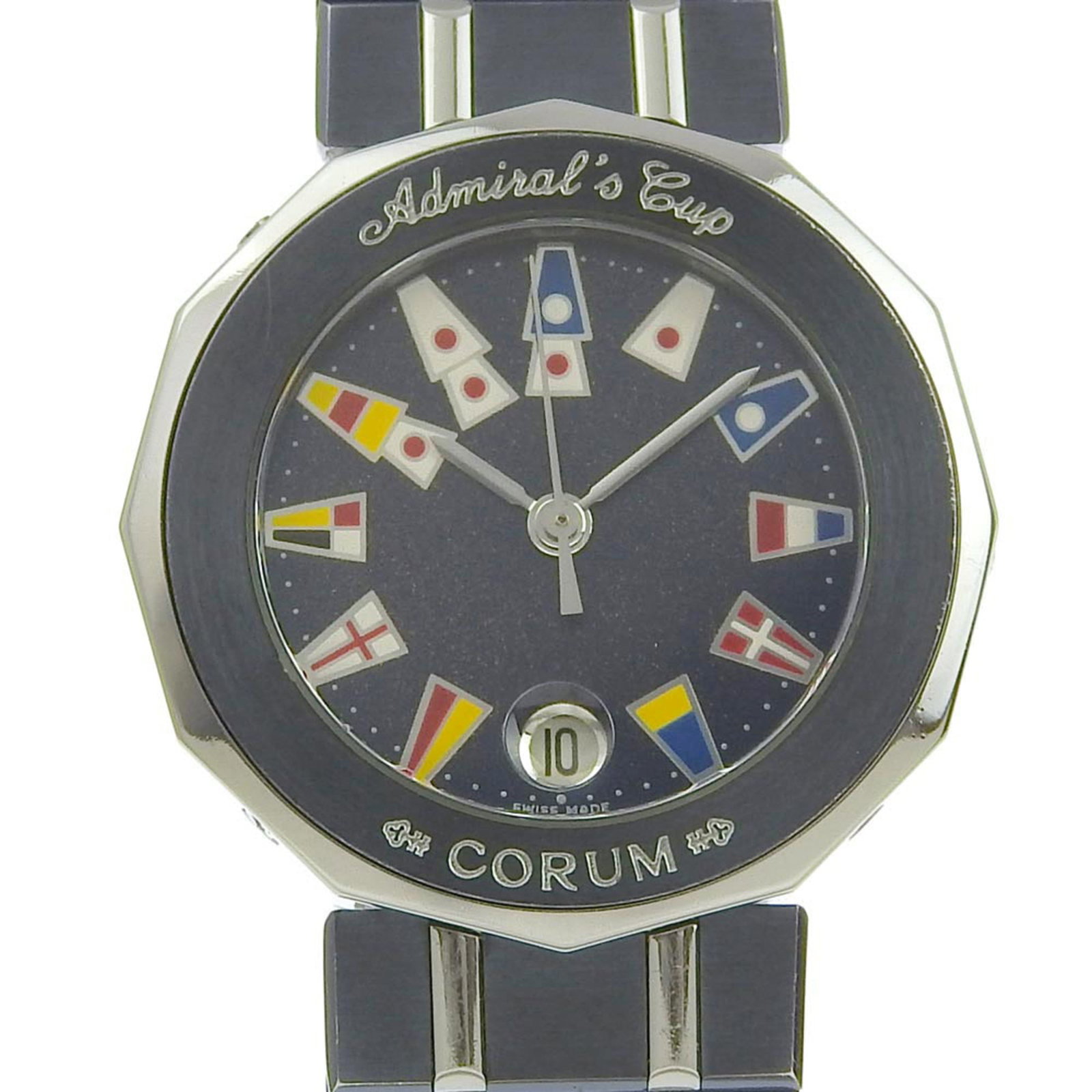 Corum Wristwatch: Corum Wristwatch Stainless steel case and band, navy blue dial, and quartz movement make up the Corum wristwatch. With its 27mm diameter and adjustable stainless steel strap, this timepiece fits a