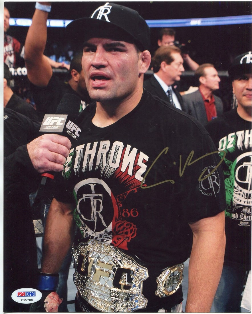Cain Velasquez Autographed 8x10 UFC Photo (PSA/ DNA): Cain Velasquez Autographed 8x10 UFC Photo (PSA/ DNA) Cain Velasquez's gold sharpie signature adds a touch of authenticity to this official UFC photo, measuring 8x10 inches. The PSA/DNA Professional Gr