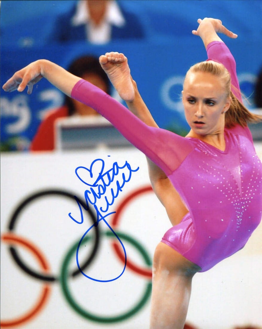 Nastia Liukin autographed photo 8x10: Nastia Liukin autographed photo 8x10 Item Specifics: Signed in blue sharpie across the front of the photo Nastia is performing at the 2008 Beijing Olympics Item is authenticated by Rich Altman's and w
