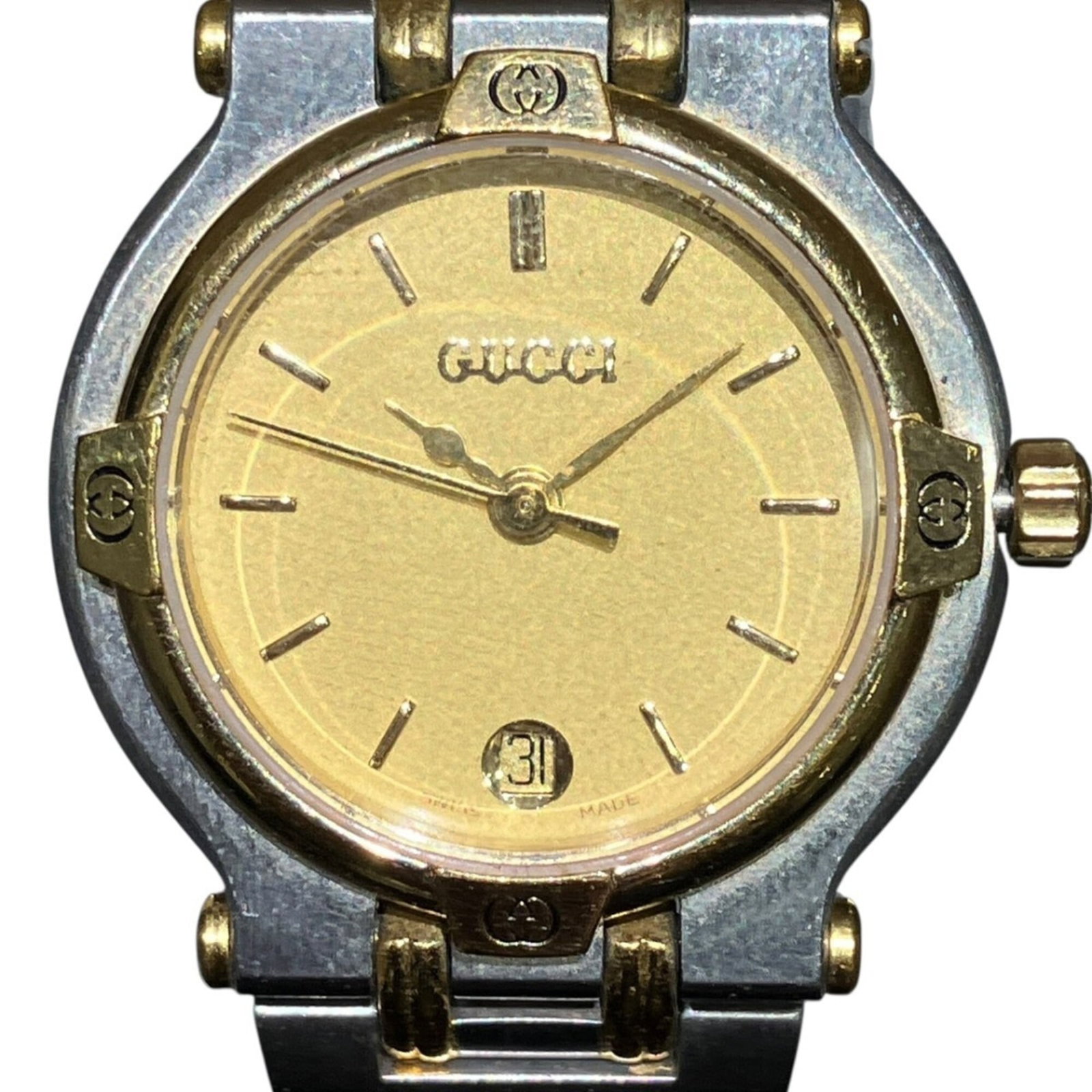 Wristwatch from Gucci: Wristwatch from Gucci Stainless steel case and band, paired with a gold dial, make for a striking combination in this Gucci wristwatch. The quartz movement ensures reliable timekeeping, while the 24mm