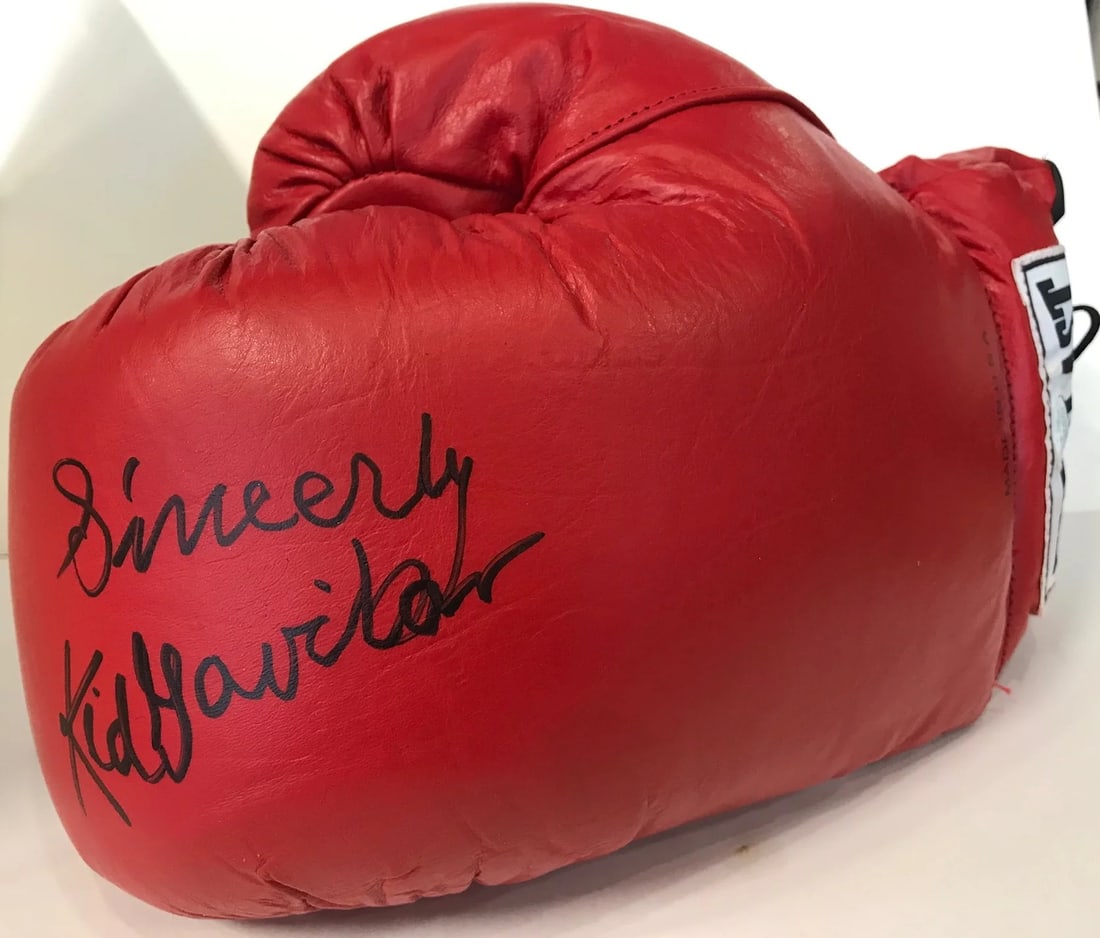 Kid Gaviln Autographed Red Everlast Left Boxing Glove (JSA): Kid Gaviln Autographed Red Everlast Left Boxing Glove (JSA) Authentic Kid Gaviln Autographed Red Everlast Left Boxing Glove. This JSA-authenticated boxing glove features a bold black sharpie signature