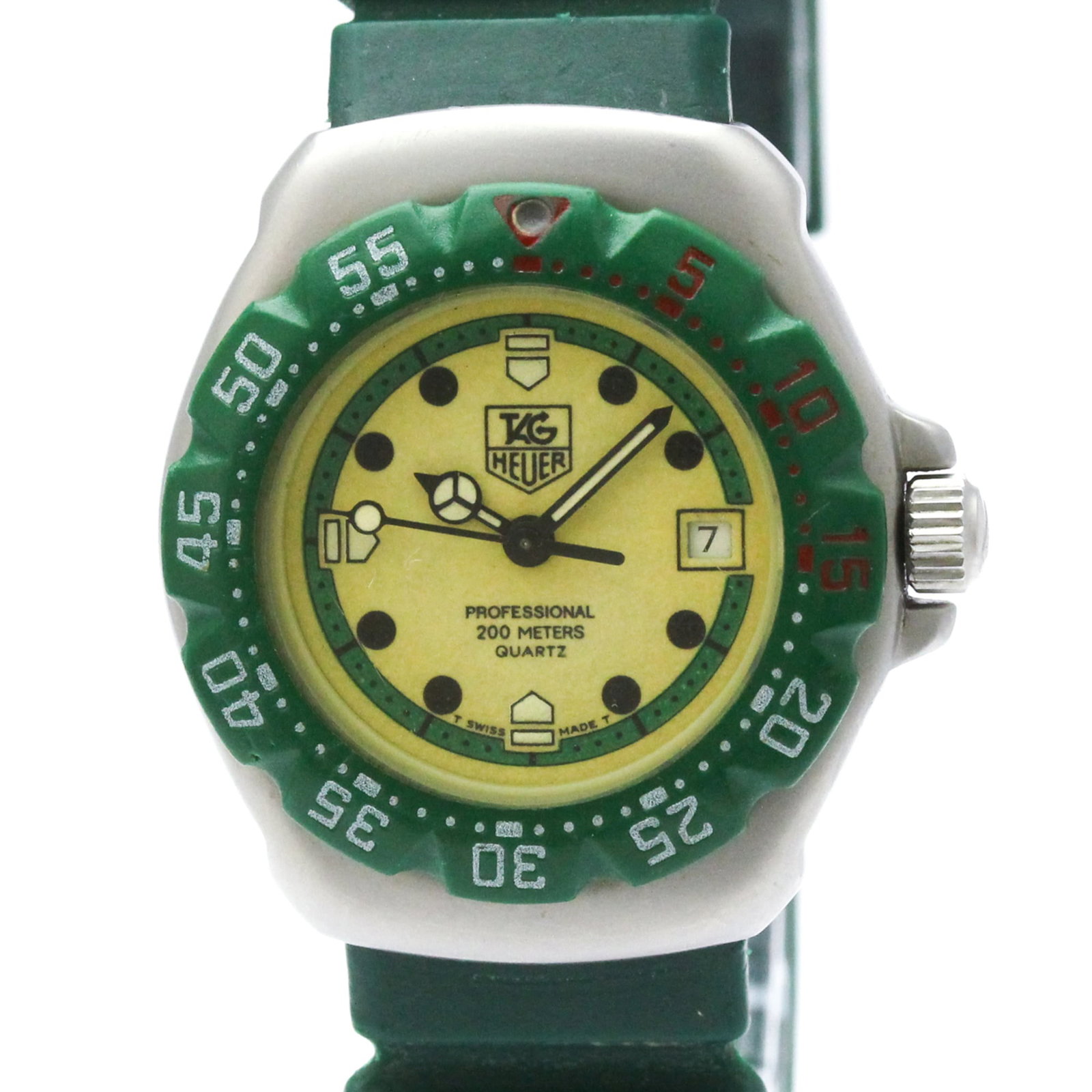 Wristwatch by Tag Heuer: Wristwatch by Tag Heuer The Tag Heuer Formula 1 watch features a sleek ivory dial and rubber band, making it a stylish accessory for everyday wear. With its quartz movement and date function, this wri