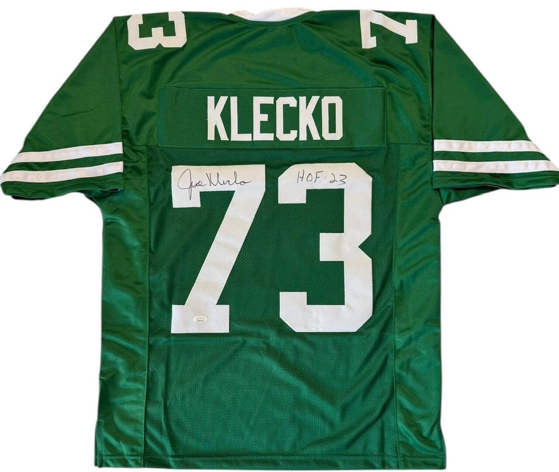 Joe Klecko Autographed Custom New York Jets Jersey (JSA Witness): Joe Klecko Autographed Custom New York Jets Jersey (JSA Witness) Joe Klecko's signature on the back of this custom New York Jets jersey reads "HOF 23" in black sharpie, a nod to his Hall of Fame