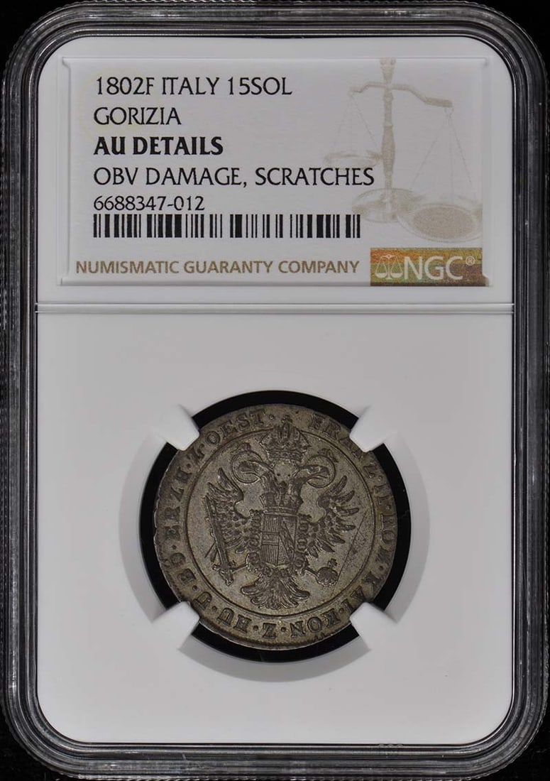 1802F ITALY GORIZIA 15SOL NGC AU Details: 1802F ITALY GORIZIA 15SOL NGC AU Details This 1802F Italy Gorizia 15 Sol NGC AU coin features an uncirculated condition, with a grade of AU Details. The coin bears a signature, but its origin and auth
