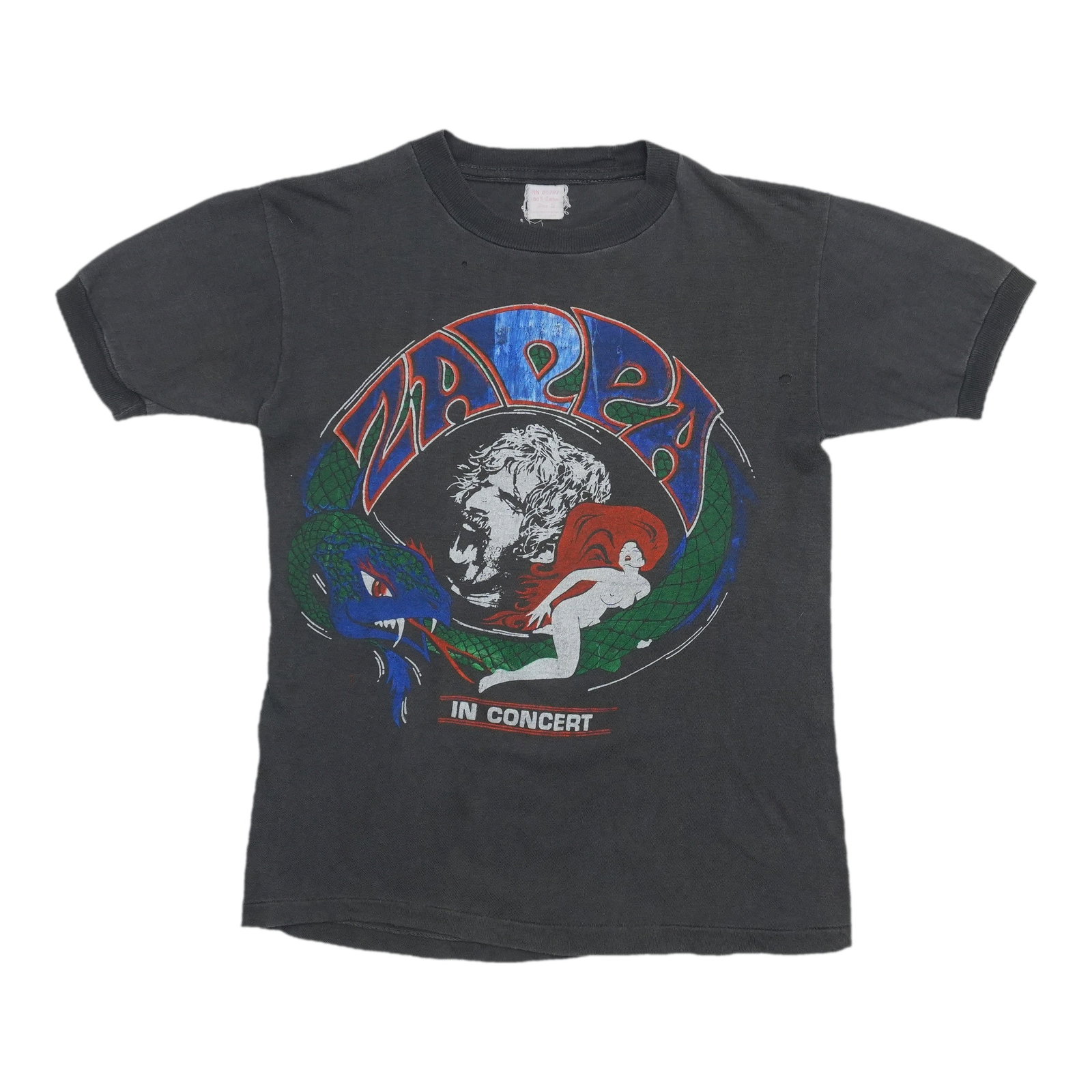 1980s Frank Zappa In Concert Shirt: 1980s Frank Zappa In Concert Shirt Authentic 1980s Frank Zappa In Concert Shirt, featuring the iconic musician's image and design. This vintage tee showcases the unique style of the era, with a bold