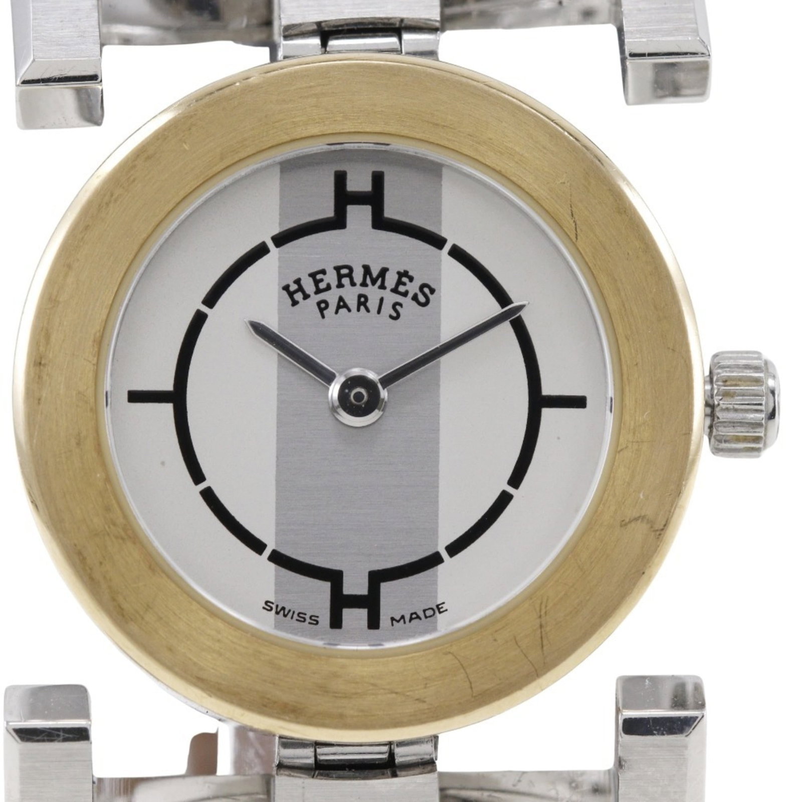 Hermes Wristwatch: Hermes Wristwatch Stainless steel case and leather band make for a sleek, timeless design. This white quartz wristwatch boasts a classic look with its simple yet elegant dial. With its durable materia