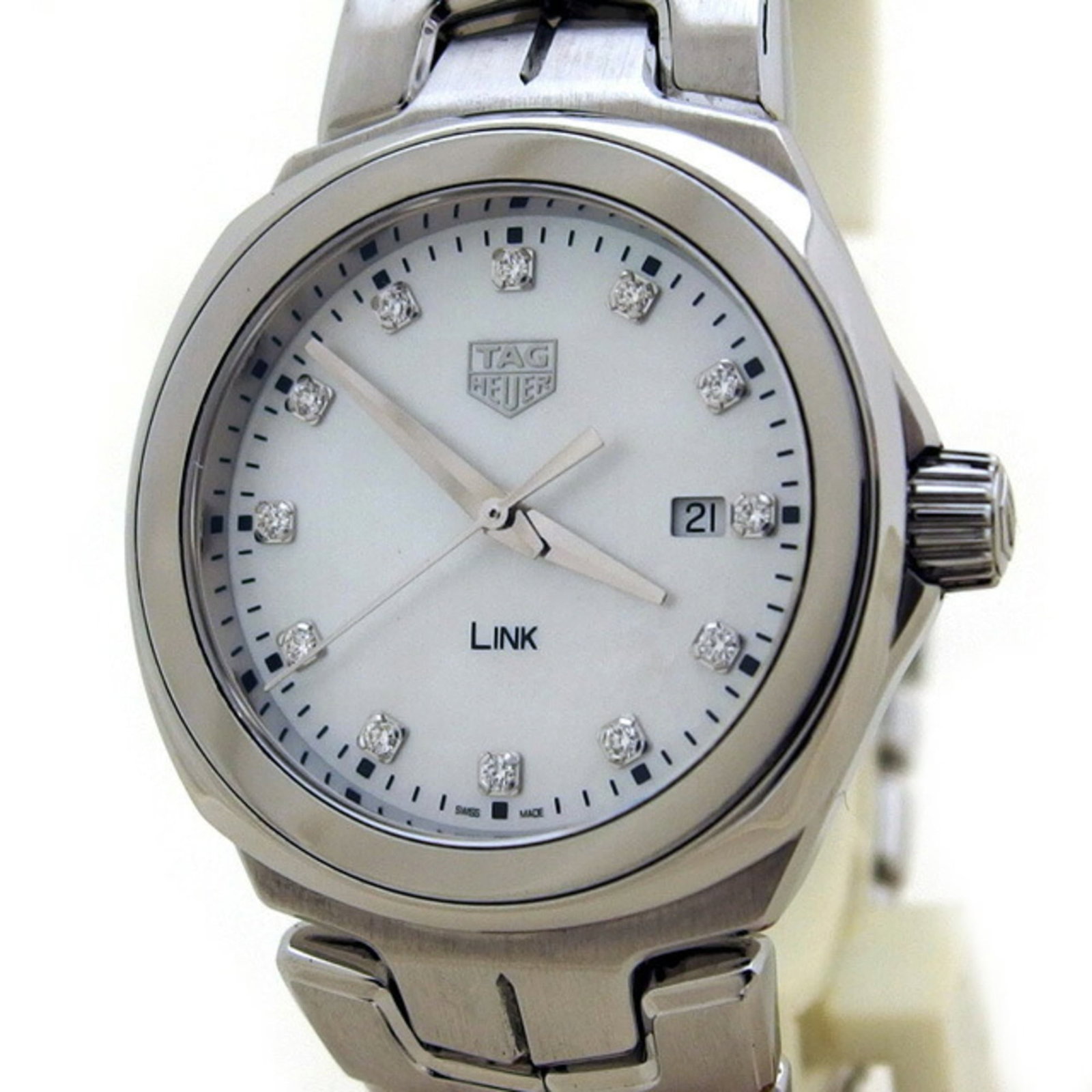 Wristwatch by Tag Heuer: Wristwatch by Tag Heuer Stainless steel case with a sleek white dial and diamond gemstone adds a touch of elegance to this quartz-powered timepiece. The Link model features a date display, making it a