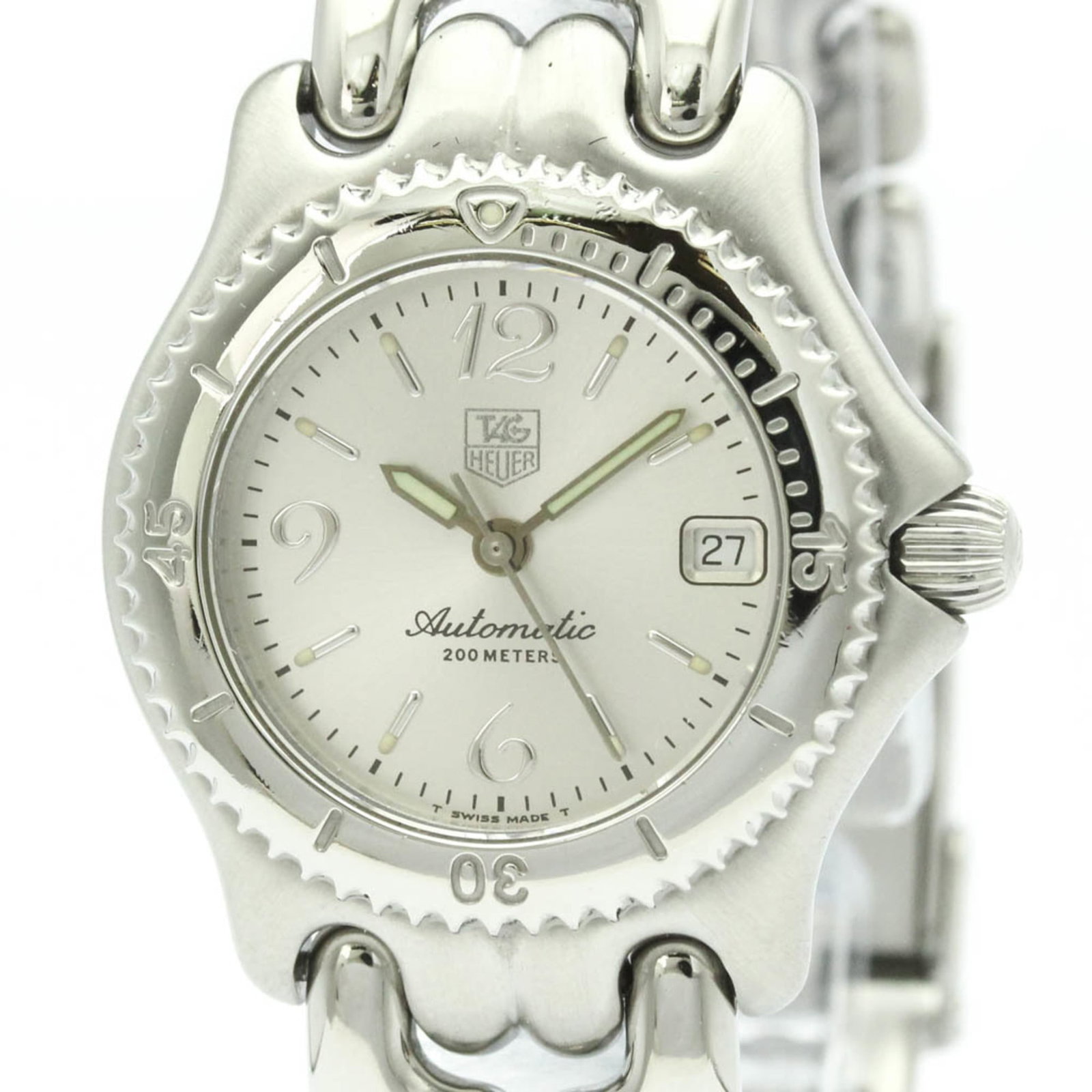Wristwatch by Tag Heuer: Wristwatch by Tag Heuer Stainless steel case and band add a sleek touch to this silver dial watch, while the self-winding automatic movement ensures precise timekeeping. The compact 28mm design makes